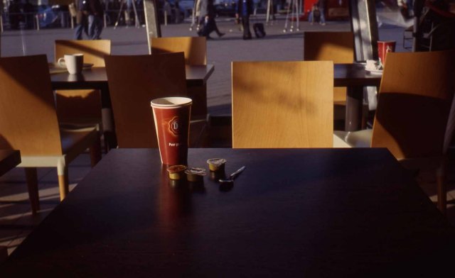 Netherlands. Amsterdam Schipol. Early morning, Duane Egbert coffee. Flight commuters background